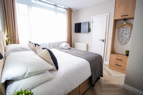 Cozy, modern bedroom with natural light.