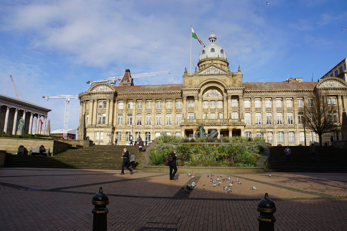 Victoria Square in Birmingham with the domed Council House and the columns of the Town Hall on the left