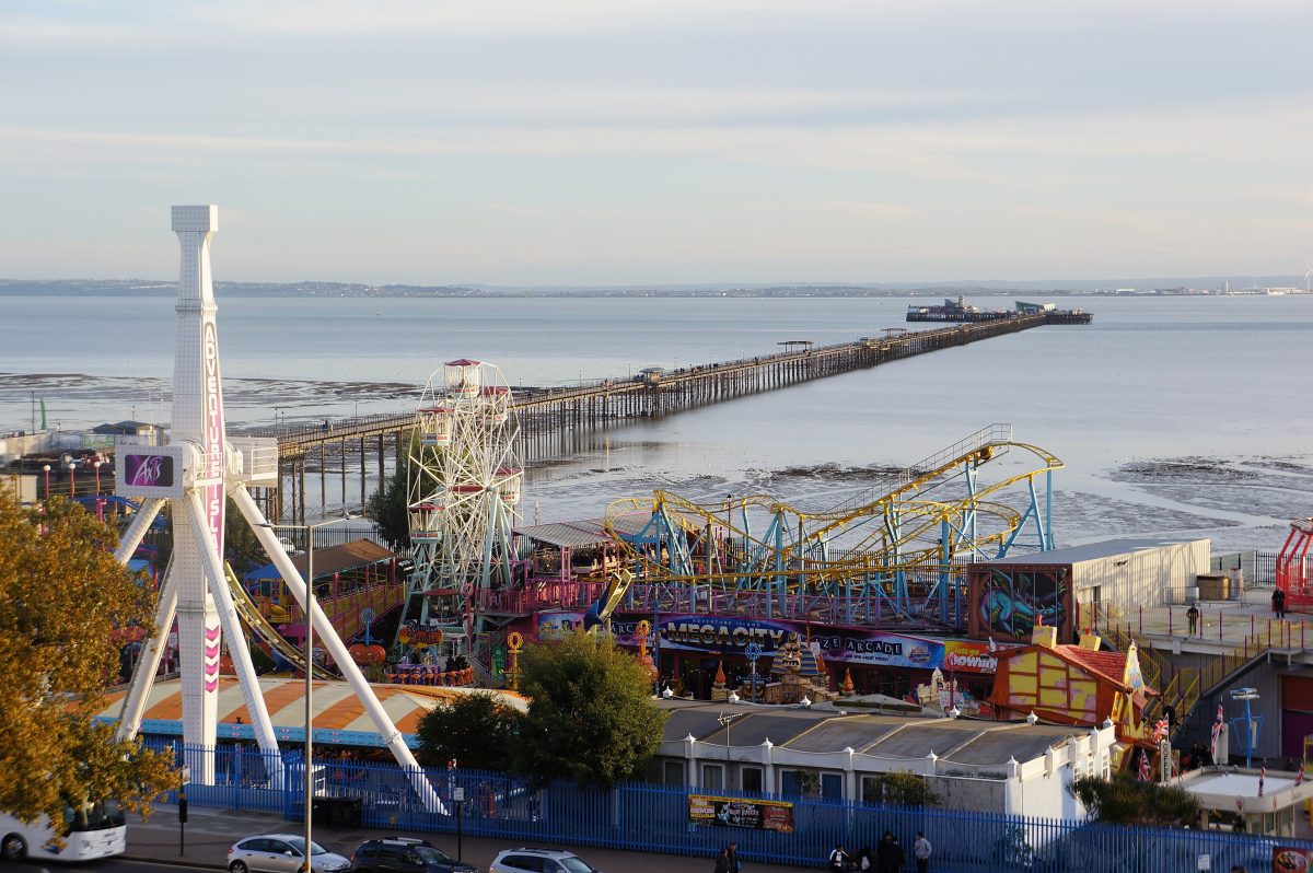 Adventure Island fairground rides on the Southend seafront, with the long pier stretching out into the estuary